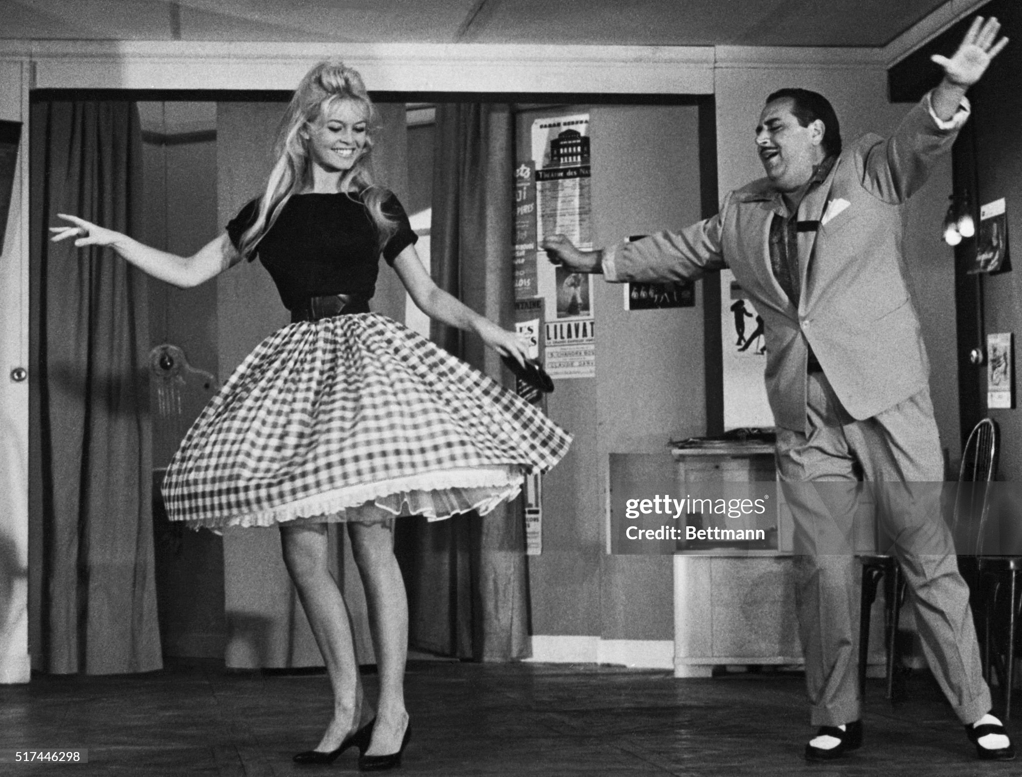 French actress Brigitte Bardot does the cha-cha under the direction of comic Darius Moreno in Nice, France, on 08 May 1959. B.B. appears in a new movie called ‘Will you dance with me’ in which Moreno plays the part of a dancing teacher. 