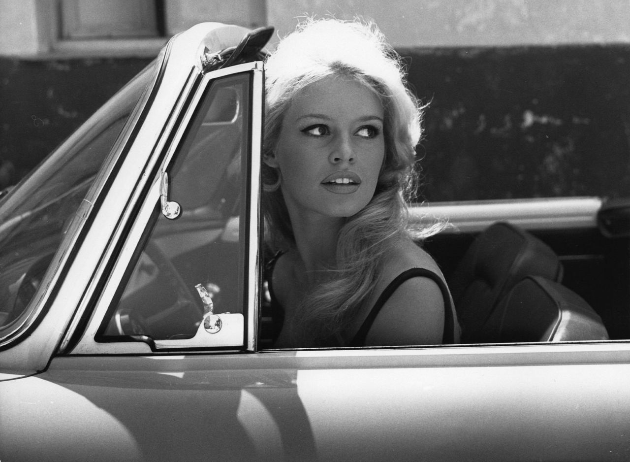 Brigitte Bardot in the car.