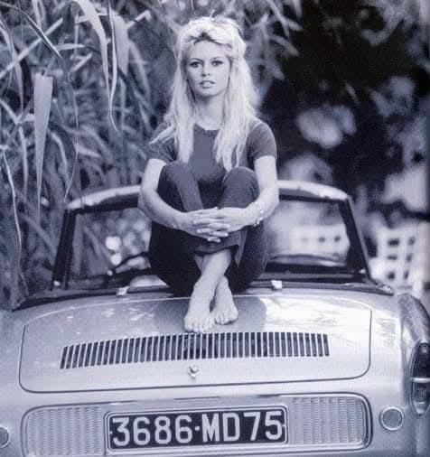 Brigitte Bardot relaxes in barefoot on her new Renault Caravelle at her villa in St. Tropez, France, on 08 October 1962.