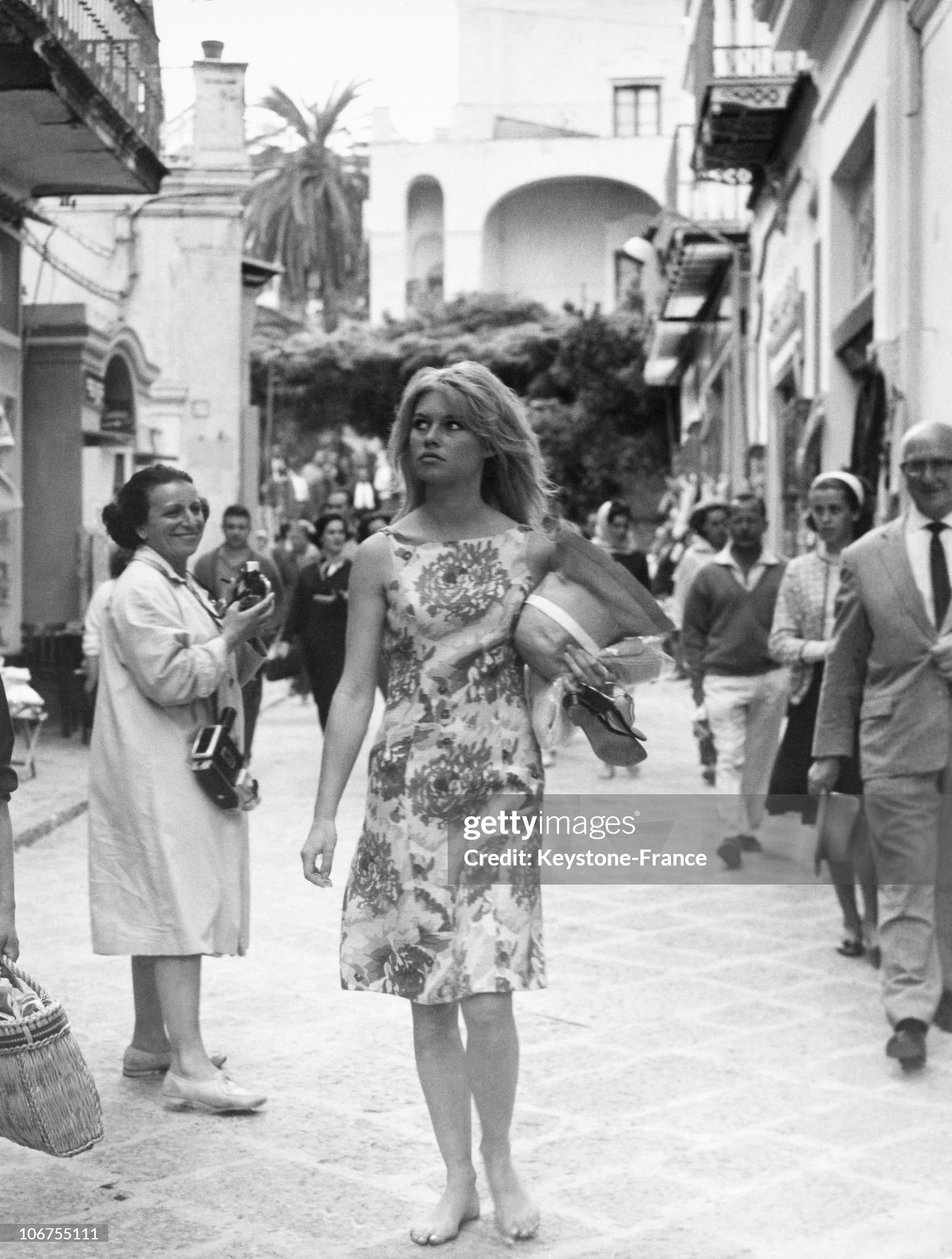Brigitte Bardot walks the streets of Capri, Italy, in 1963. 