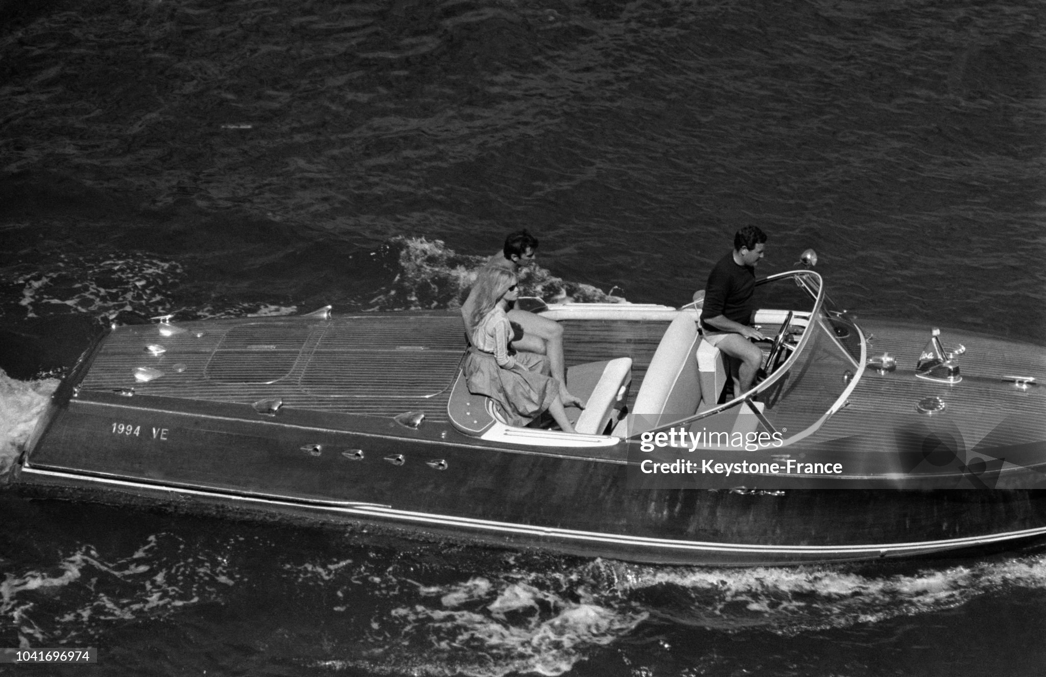 Brigitte Bardot with her boyfriend actor Sami Frey aboard a Riva speedboat during the shooting of the movie 'Le Mépris' directed by Jean-Luc Godard in Capri, Italy, on 26 May 1963. 