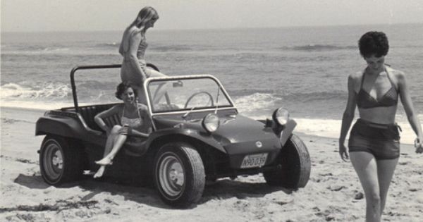 A Dune Buggy on the beach with three girls.