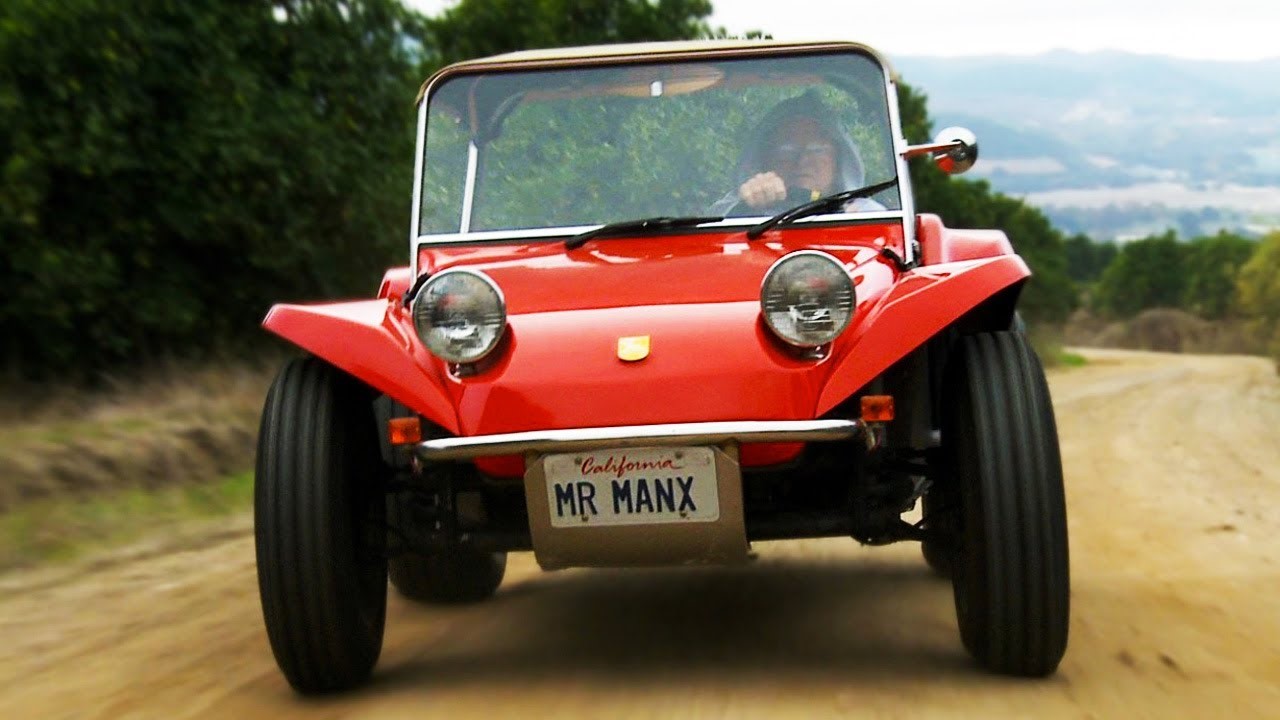 Bruce Meyers driving his red Manx.