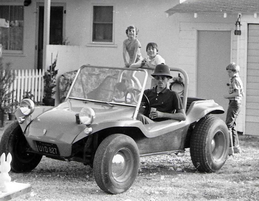 A Dune Buggy and a family.