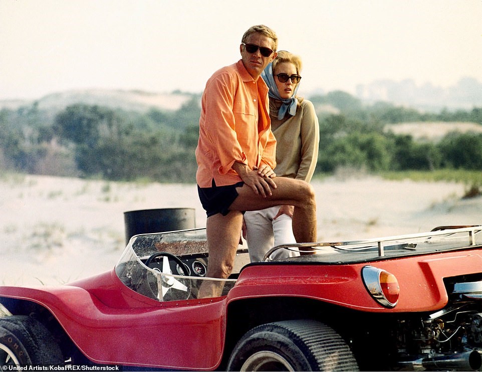 Faye Dunaway and Steve McQueen in an orange Dune Buggy in the movie 'The Thomas Crown Affair'.
