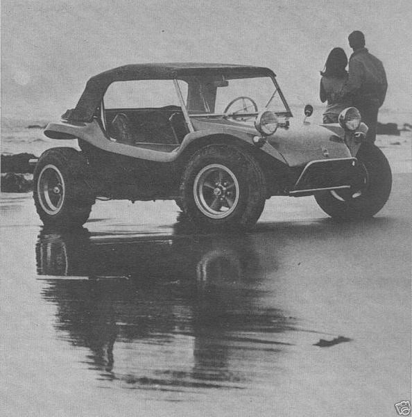 A young couple and a Dune Buggy on the beach.