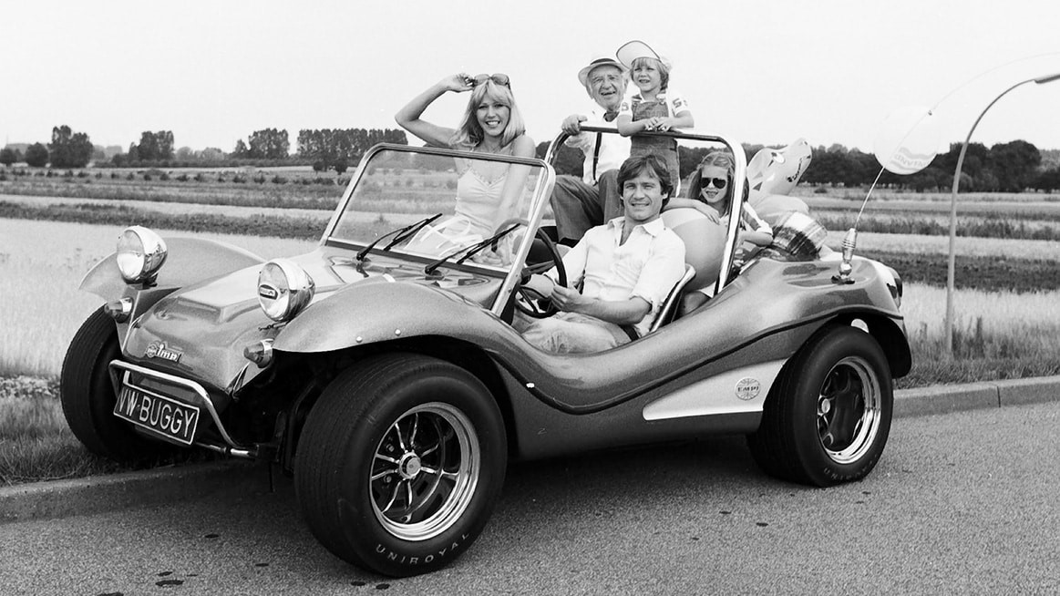 A family in a Dune Buggy.