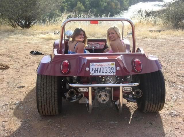Two girls in a Dune Buggy.