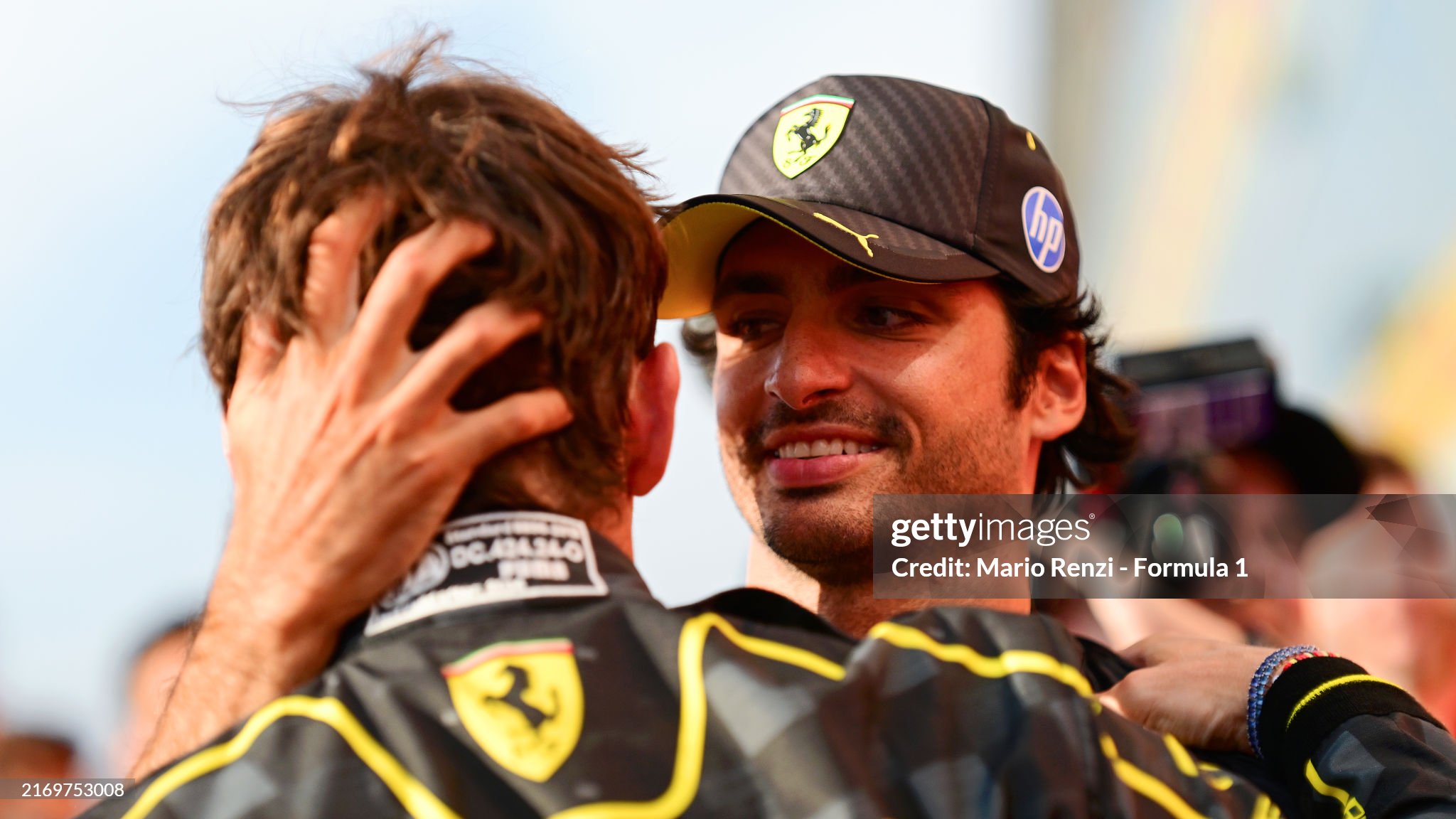 Race winner Charles Leclerc of Monaco and Ferrari and fourth placed Carlos Sainz of Spain and Ferrari celebrate the win with the team during the F1 Grand Prix of Italy at Autodromo Nazionale Monza on September 01, 2024. 