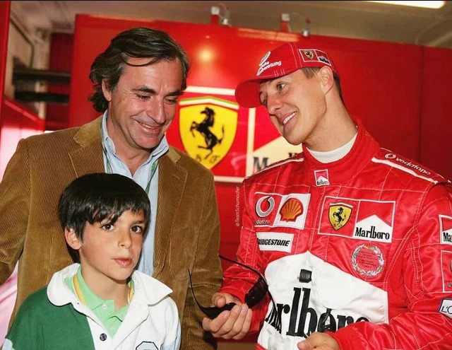 Carlos Sainz with his father and Michael Schumacher.