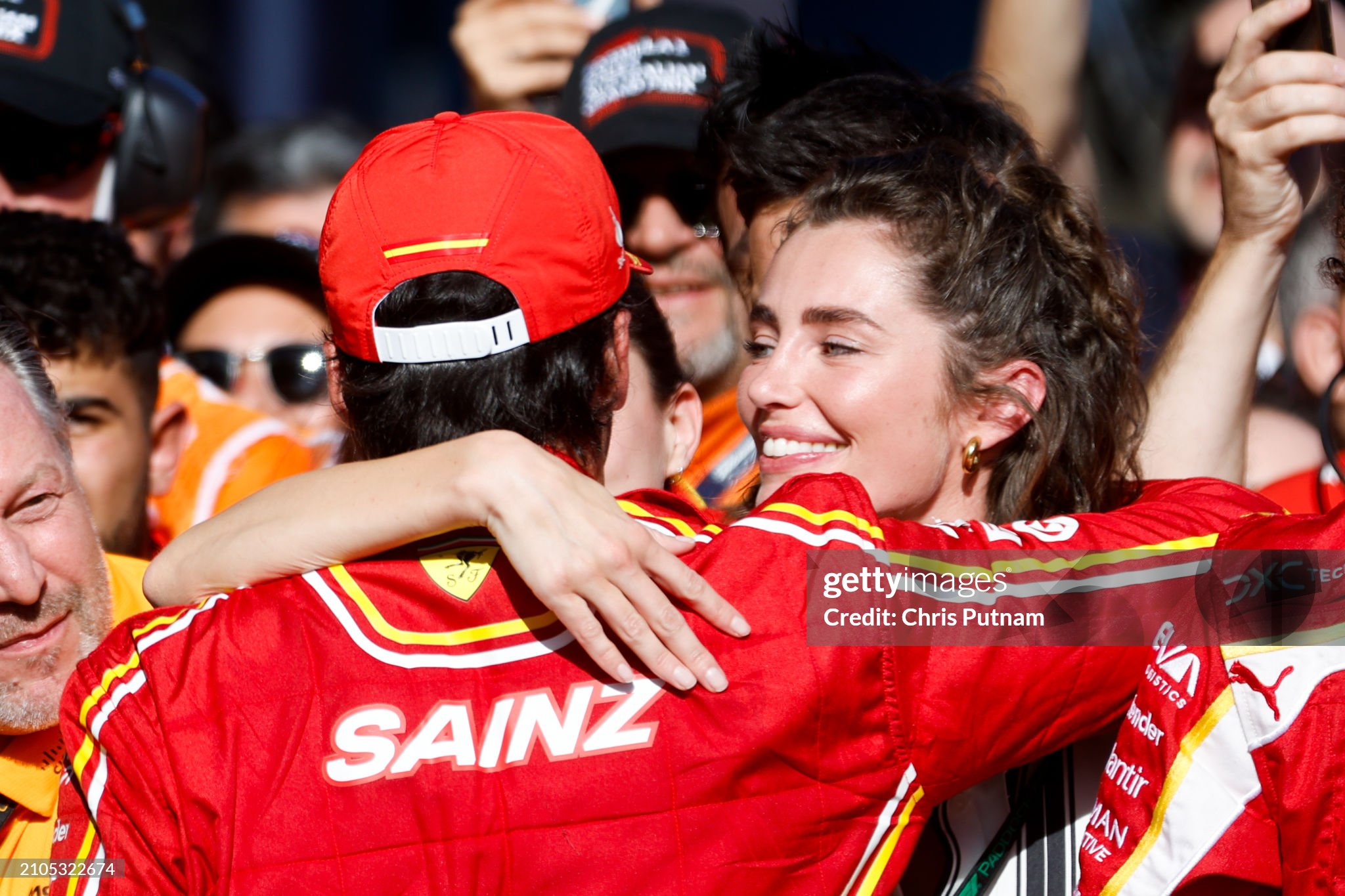 Rebecca Donaldson, girlfriend of Carlos Sainz of Spain and Scuderia Ferrari, embraces Carlos after he won the 2024 Australian Grand Prix at Albert Park in Melbourne, Australia. 