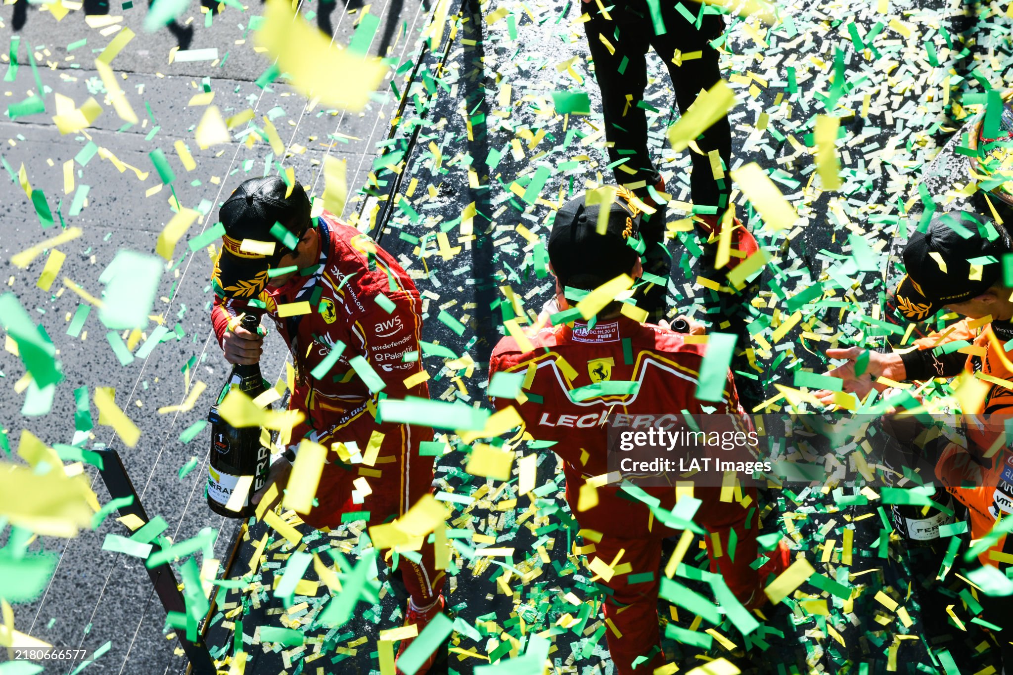 Race winner Carlos Sainz, Ferrari, on the podium with Charles Leclerc, Ferrari and Lando Norris, McLaren, after the Australian GP at Melbourne Grand Prix Circuit on Sunday March 24, 2024. 