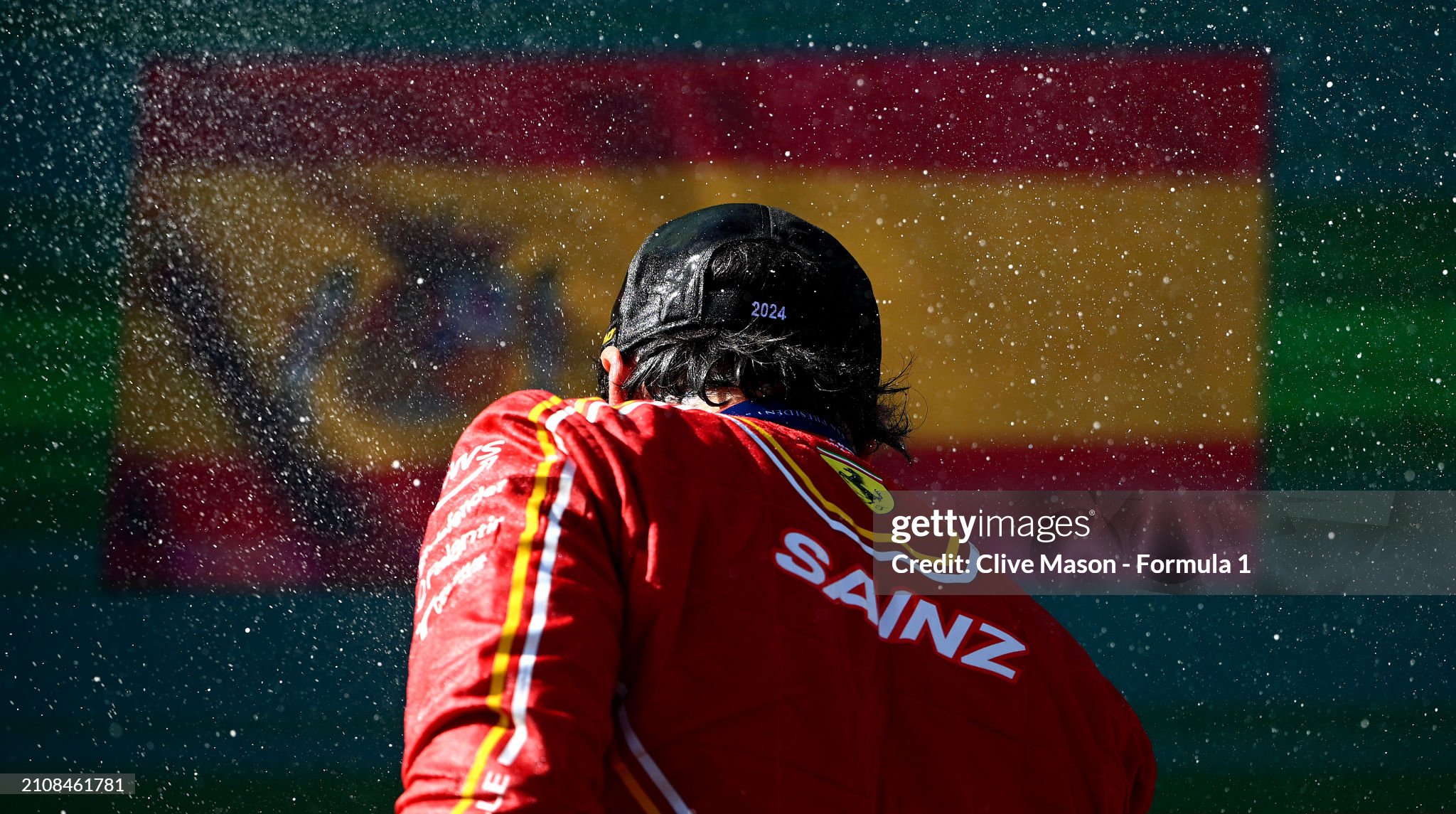 Race winner Carlos Sainz of Spain and Ferrari celebrates on the podium after the F1 Grand Prix of Australia at Albert Park Circuit on March 24, 2024. 