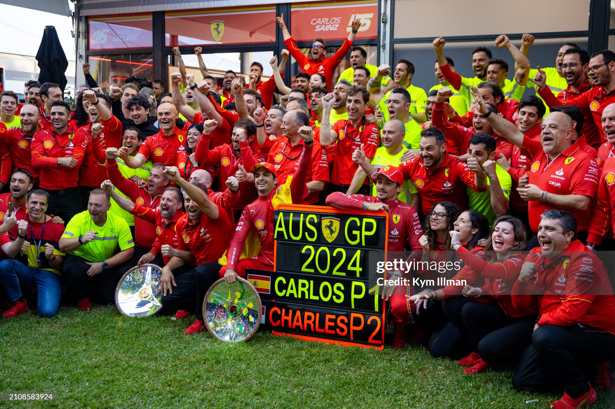 Race winner Carlos Sainz of Spain and Ferrari and second placed Charles Leclerc of Monaco and Ferrari celebrate with team members following the F1 Grand Prix of Australia at Albert Park Circuit in Melbourne, Australia, on March 24, 2024. 