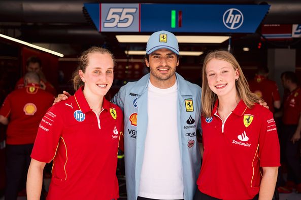 Carlos Sainz with Ferrari F1 Academy female drivers Maya Weug (left) and Aurelia Nobels (right) before heading out on track at the Miami Grand Prix on May 04, 2024.