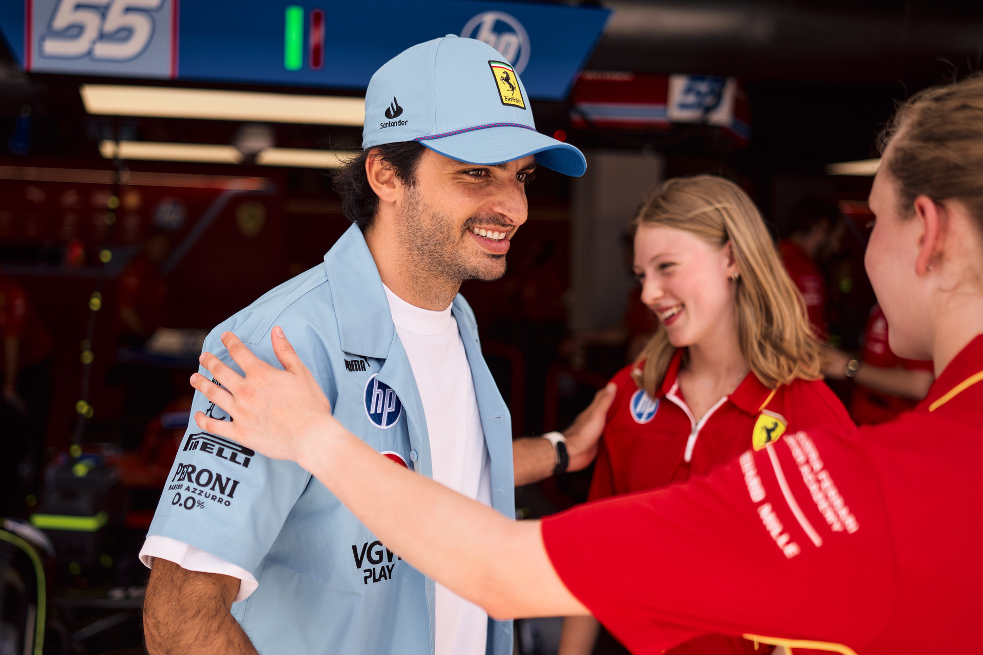 Carlos Sainz with Ferrari F1 Academy female drivers Maya Weug and Aurelia Nobels before heading out on track at the Miami Grand Prix on May 04, 2024.