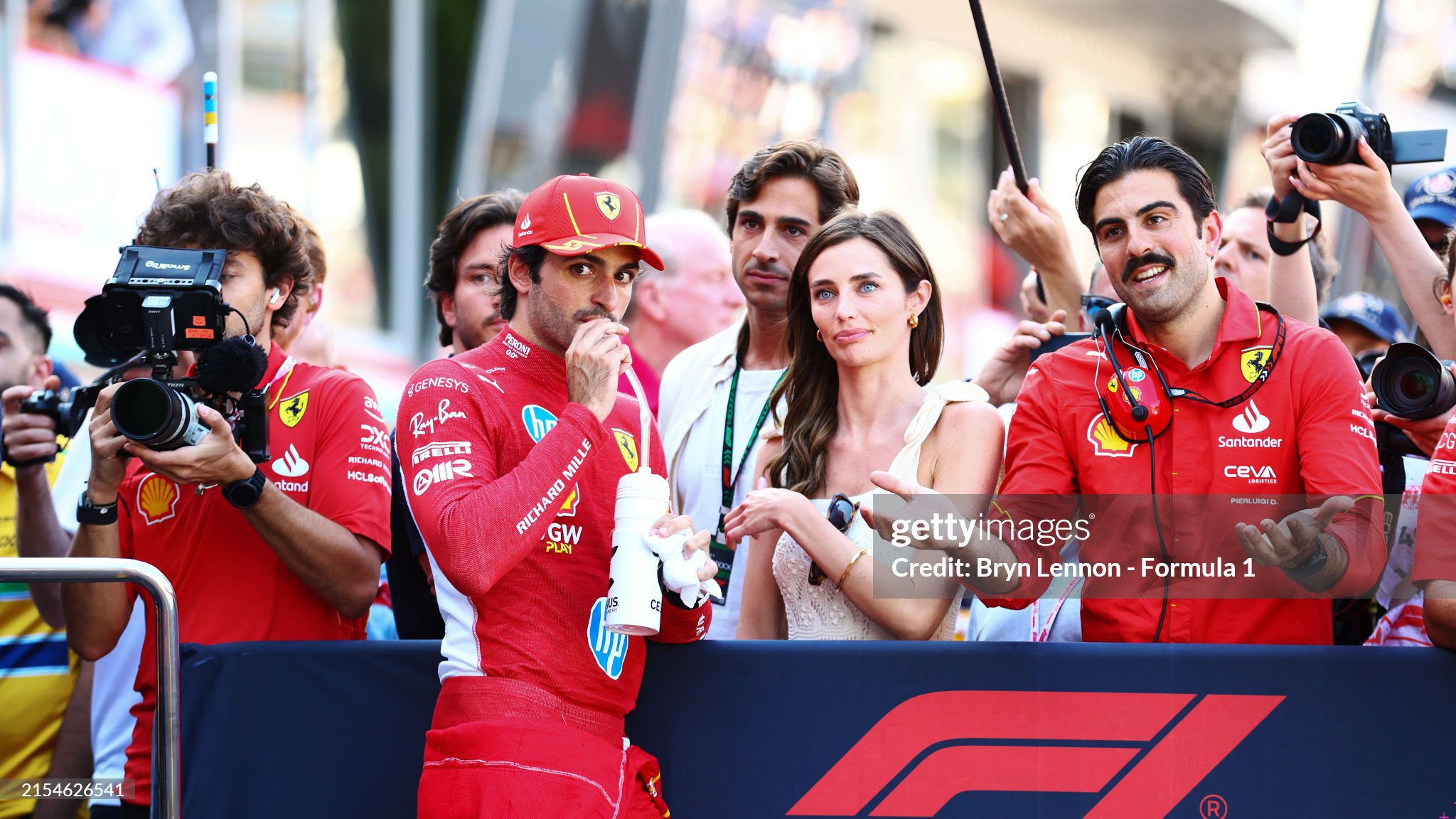 Third placed qualifier Carlos Sainz of Spain and Ferrari and Rebecca Donaldson look on in Parc Ferme during qualifying ahead of the F1 Grand Prix of Monaco at Circuit de Monaco on May 25, 2024. 