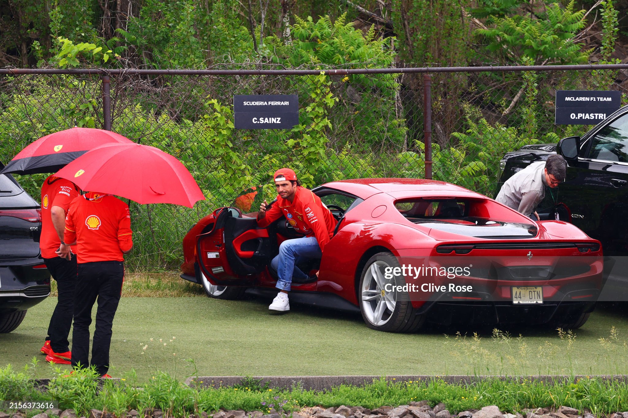 Carlos Sainz in a red Ferrari arrives in the paddock during previews ahead of the F1 Grand Prix of Canada at Circuit Gilles Villeneuve in Montreal, Quebec, on June 06, 2024. 