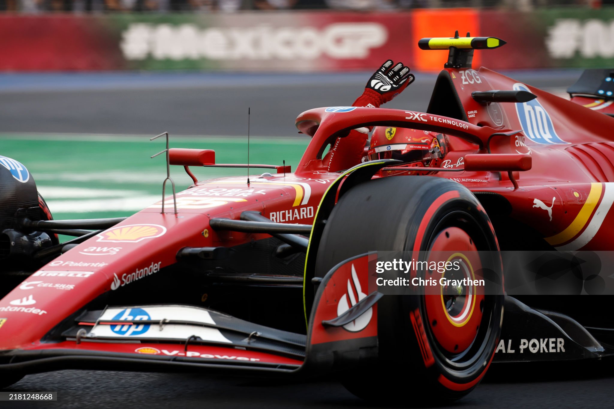 Pole position qualifier Carlos Sainz, driving the Ferrari SF-24, waves to the crowd during qualifying ahead of the F1 Grand Prix of Mexico at Autodromo Hermanos Rodriguez in Mexico City on October 26, 2024. 