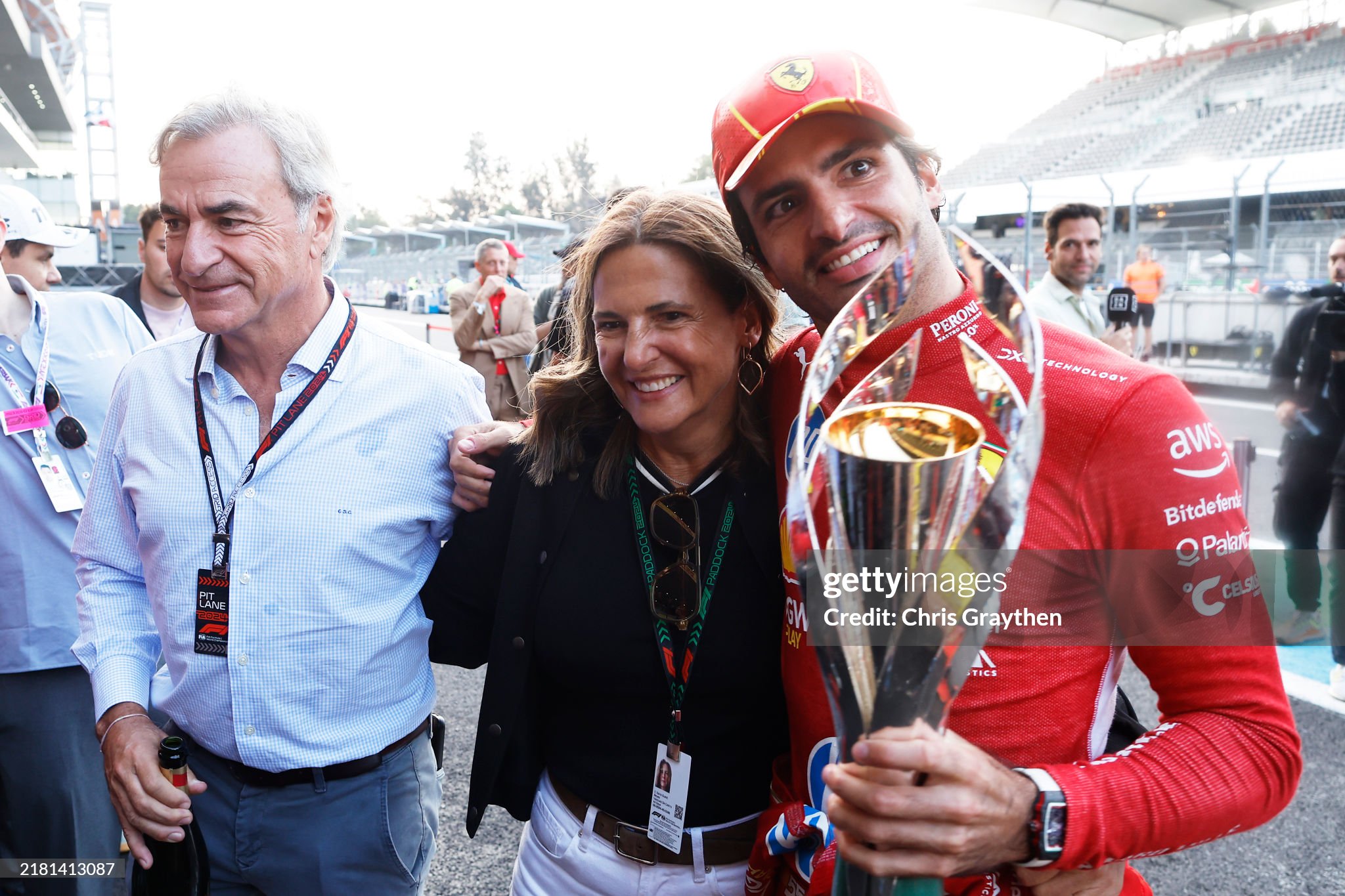 Race winner Carlos Sainz of Spain and Ferrari celebrates with Carlos Sainz Sr and Reyes Vázquez de Castro after the F1 Grand Prix of Mexico at Autodromo Hermanos Rodriguez in Mexico City, Mexico, on October 27, 2024. 