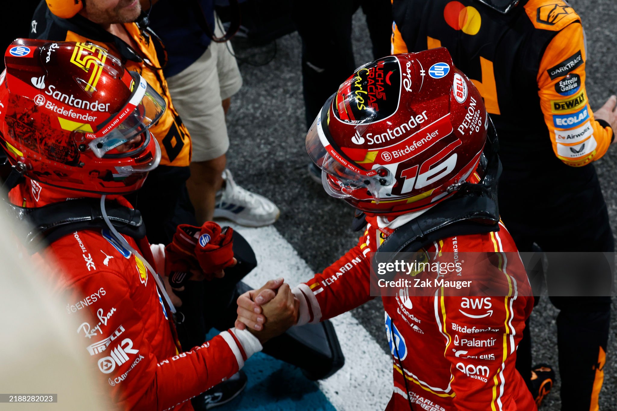 Carlos Sainz, 2nd position and Charles Leclerc, 3rd position, congratulate each other after the F1 Grand Prix of Abu Dhabi on December 08, 2024. 