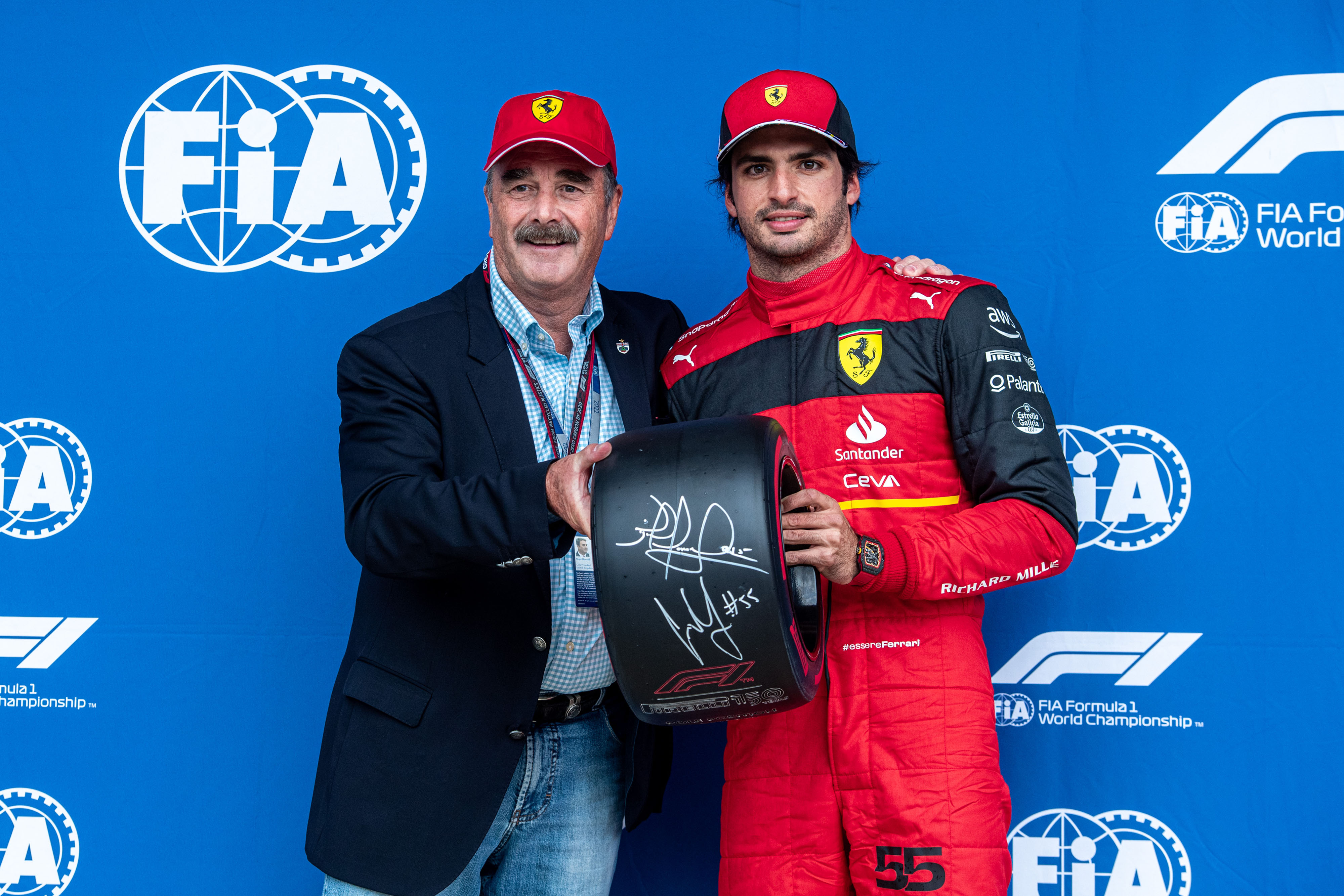 Carlos Sainz rewarded by Nigel Mansell after pole at Silverstone on 02 July 2022. 