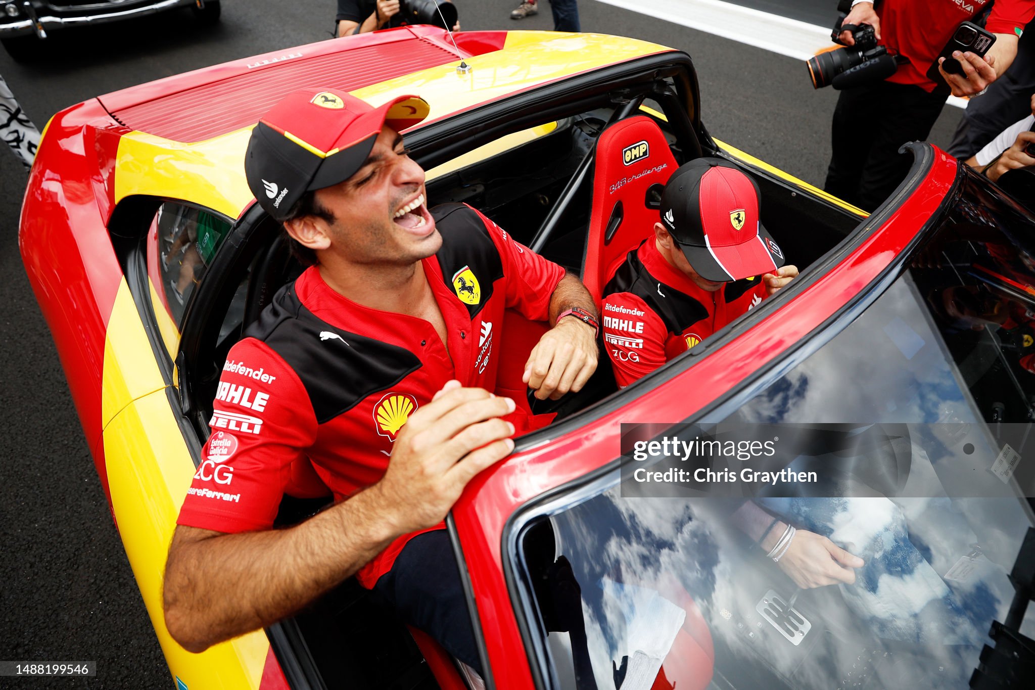 Carlos Sainz of Spain and Ferrari laughs at the drivers parade prior to the F1 Grand Prix of Miami at Miami International Autodrome on May 07, 2023. 