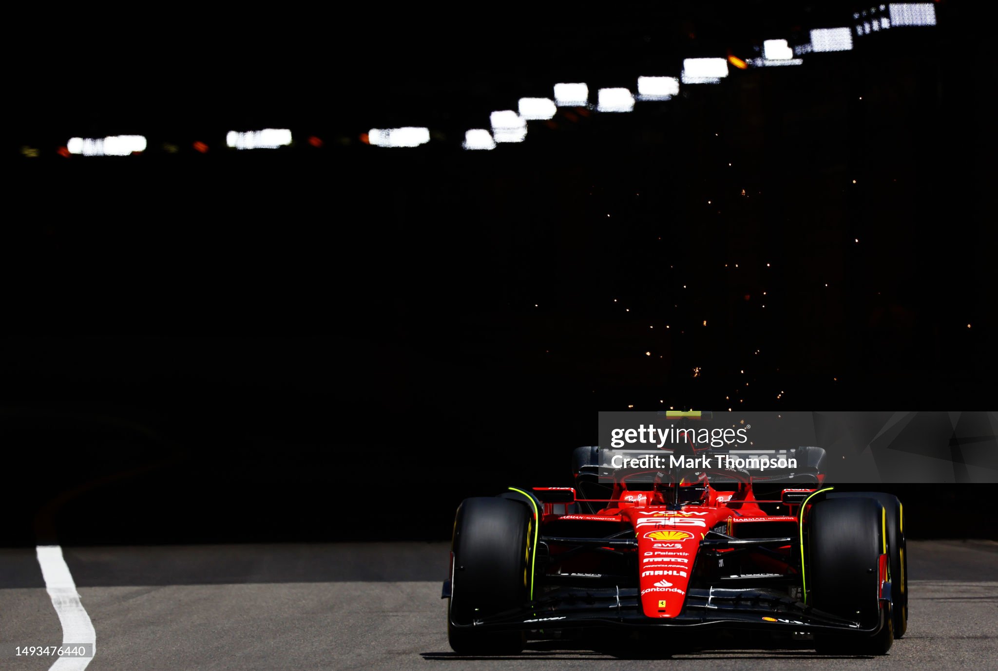 Sparks fly behind Carlos Sainz driving the Ferrari SF-23 during practice ahead of the F1 Grand Prix of Monaco on May 26, 2023 in Monte-Carlo, Monaco. 