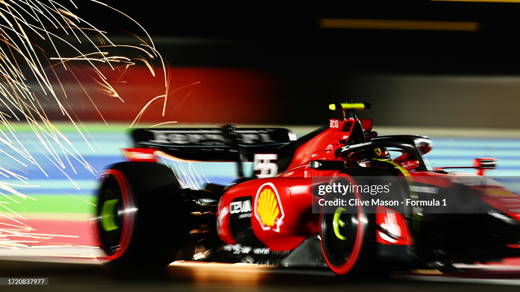 Sparks fly behind Carlos Sainz, driving the Ferrari SF-23, during qualifying ahead of the F1 Grand Prix of Qatar at Lusail International Circuit on October 06, 2023 in Lusail City, Qatar. 