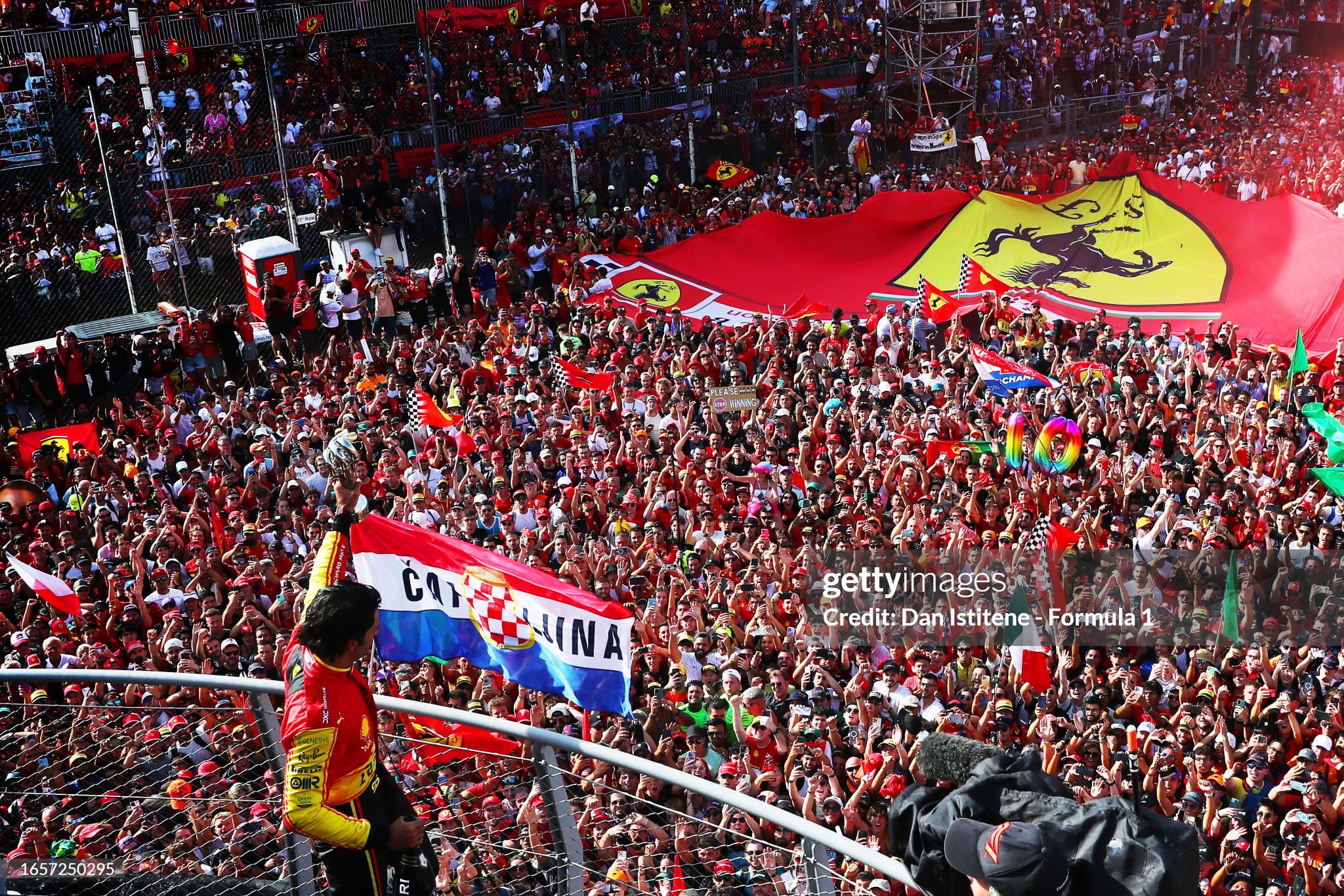 Third placed Carlos Sainz of Spain and Ferrari celebrates on the podium during the F1 Grand Prix of Italy at Autodromo Nazionale of Monza on September 03, 2023.