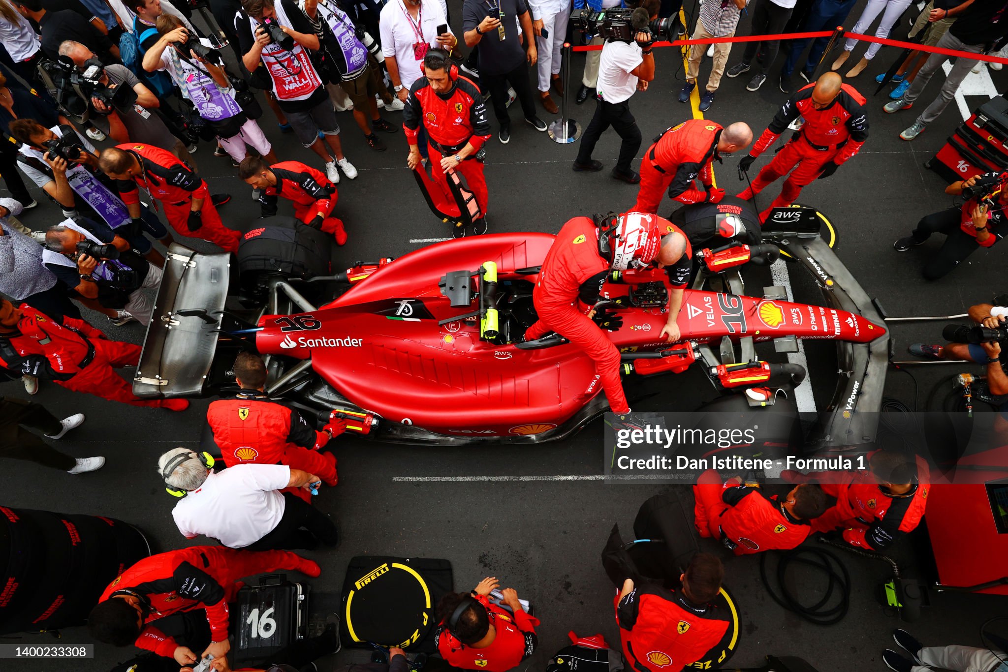 Charles Leclerc climbs out of his Ferrari F1-75 on the grid as he prepares ahead of the F1 Grand Prix of Monaco on May 29, 2022. 