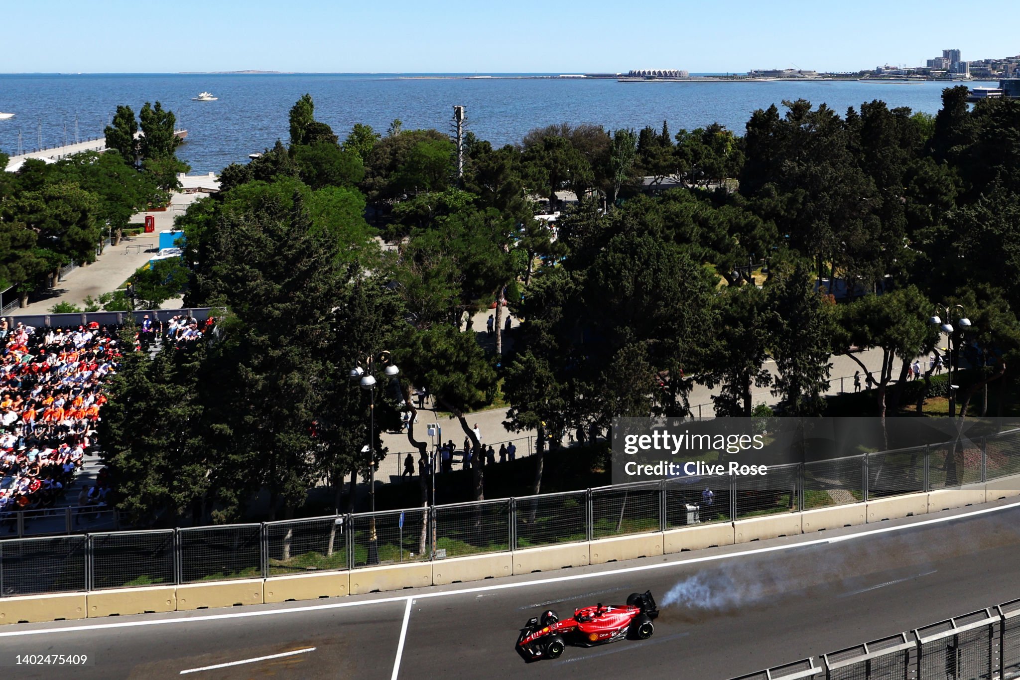 Smoke pours from the car of Charles Leclerc, driving the Ferrari F1-75, as his engine fails leading to him retiring from the F1 Grand Prix of Azerbaijan on June 12, 2022.