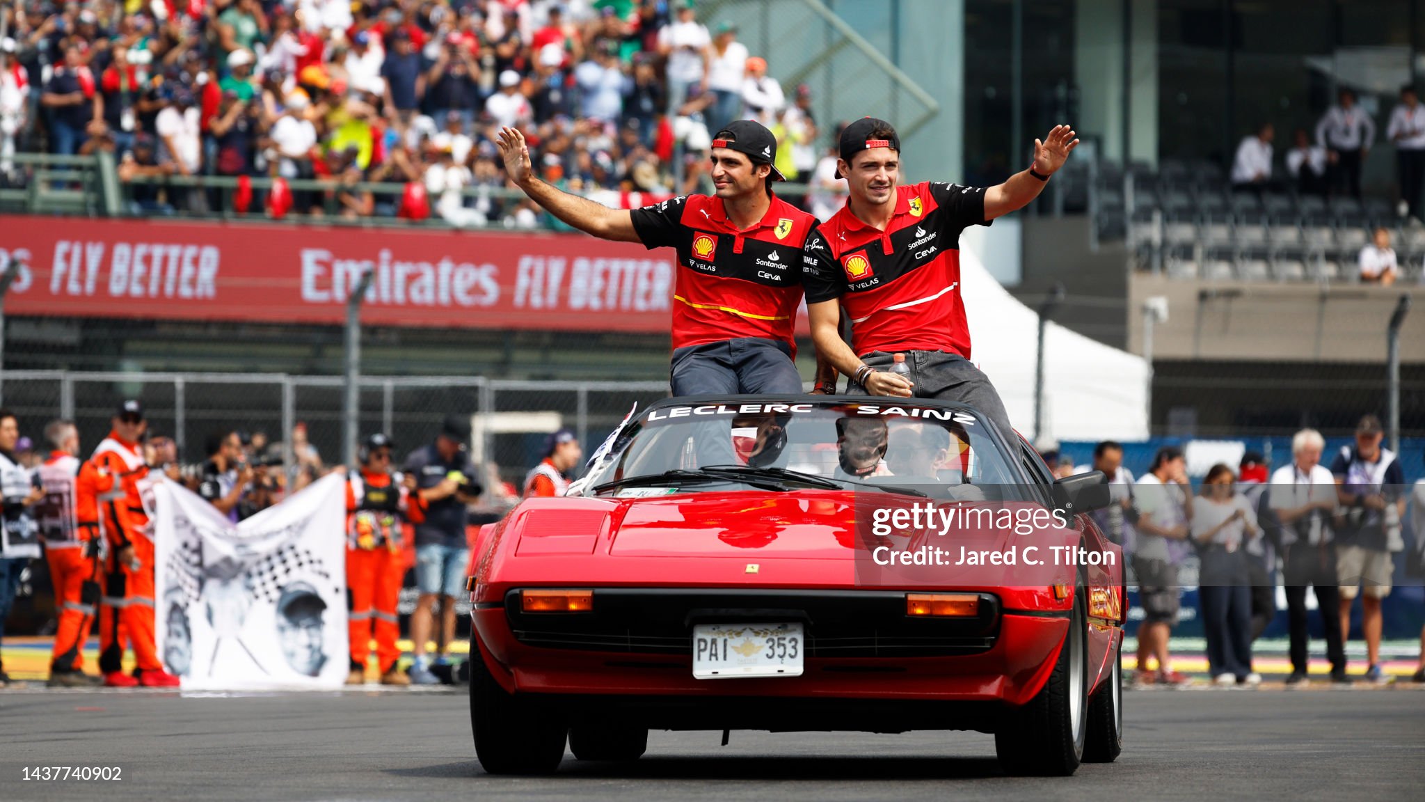 Charles Leclerc and Carlos Sainz wave to the crowd at the drivers parade prior to the F1 Grand Prix of Mexico at Autodromo Hermanos Rodriguez on October 30, 2022. 