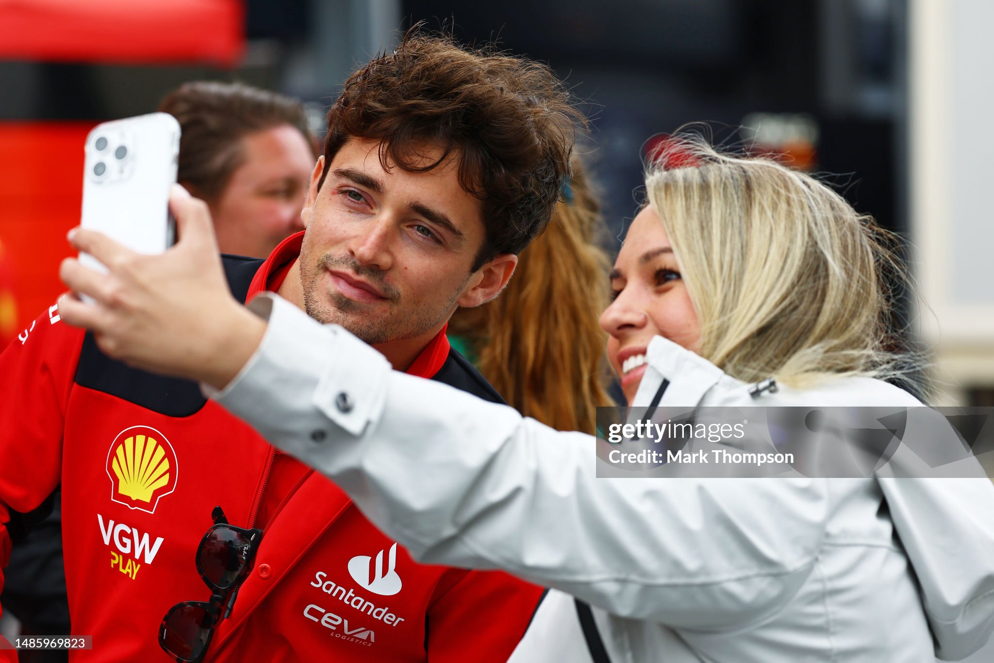 Charles Leclerc of Monaco and Ferrari poses for a photo with a fan prior to practice ahead of the F1 Grand Prix of Azerbaijan at Baku on April 28, 2023. 