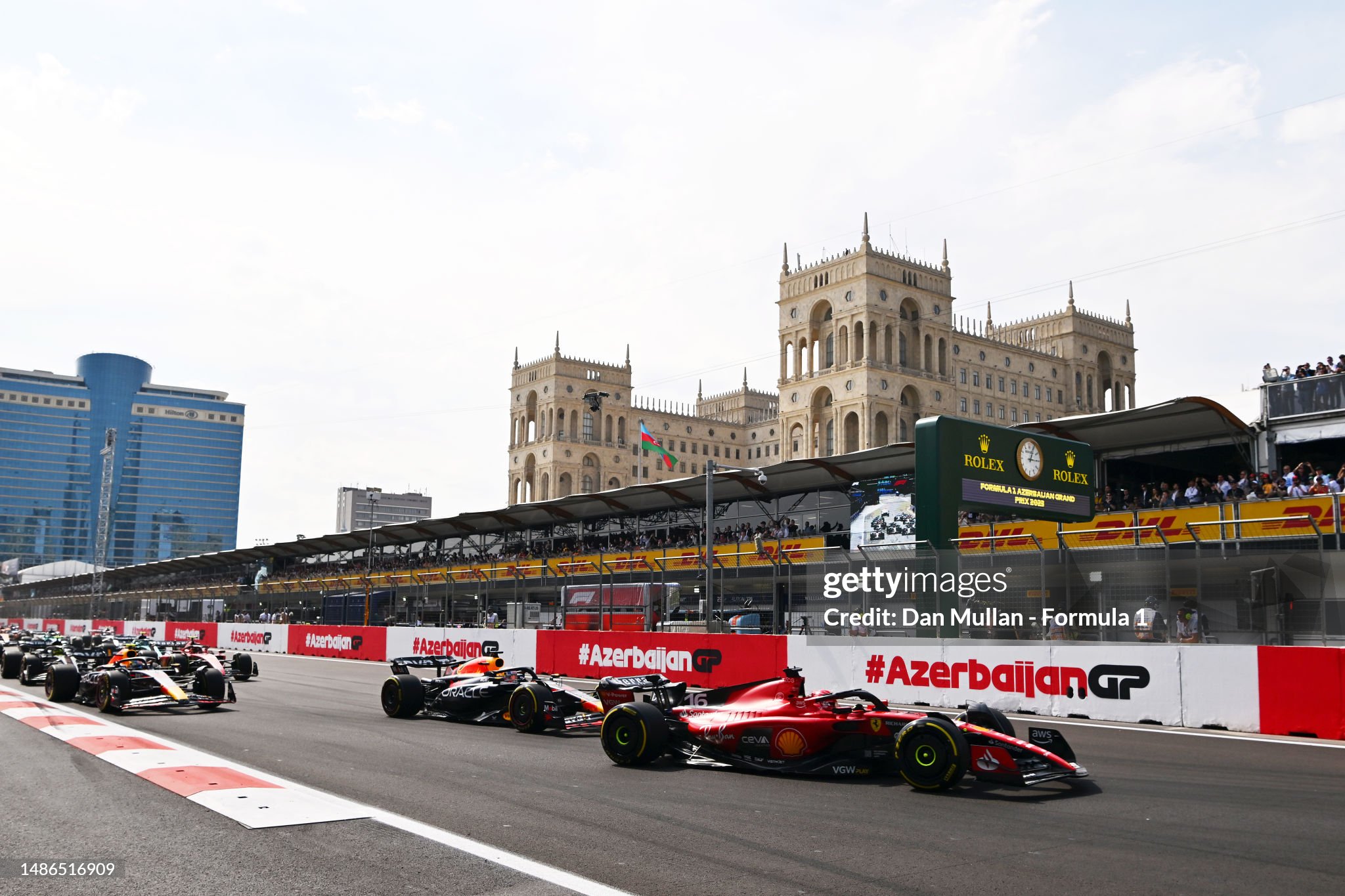 Charles Leclerc driving the Ferrari SF-23 leads Max Verstappen driving the Red Bull Racing RB19 and the rest of the field at the start of the Azerbaijan Grand Prix at Baku City Circuit on Sunday April 30, 2023. 