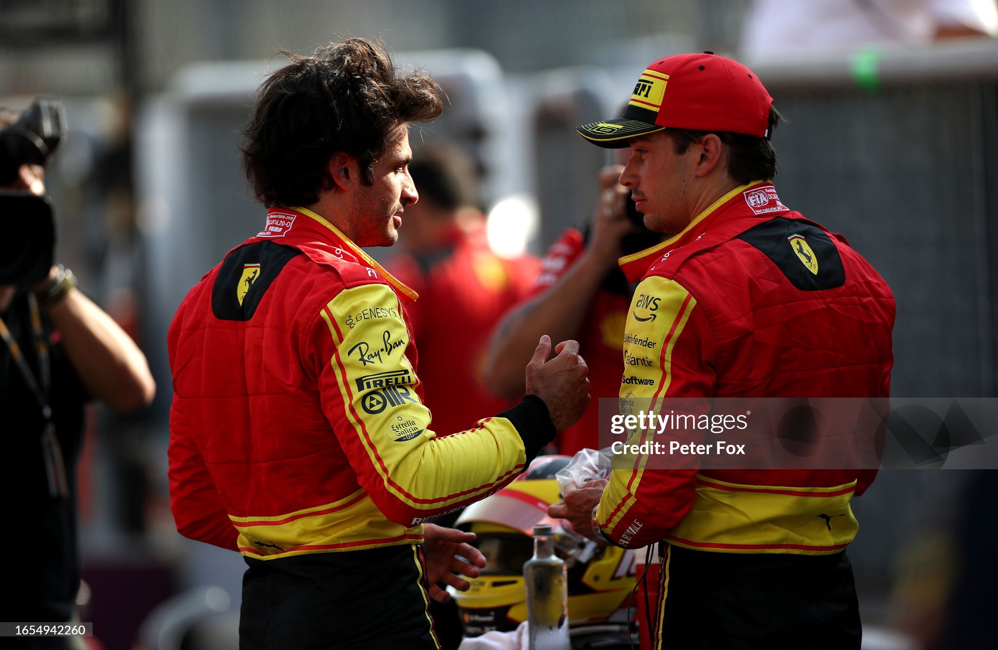 Pole position qualifier Carlos Sainz of Spain and Ferrari and third placed qualifier Charles Leclerc of Monaco and Ferrari talk in parc ferme during qualifying ahead of the F1 Grand Prix of Italy at Autodromo Nazionale Monza on September 02, 2023.