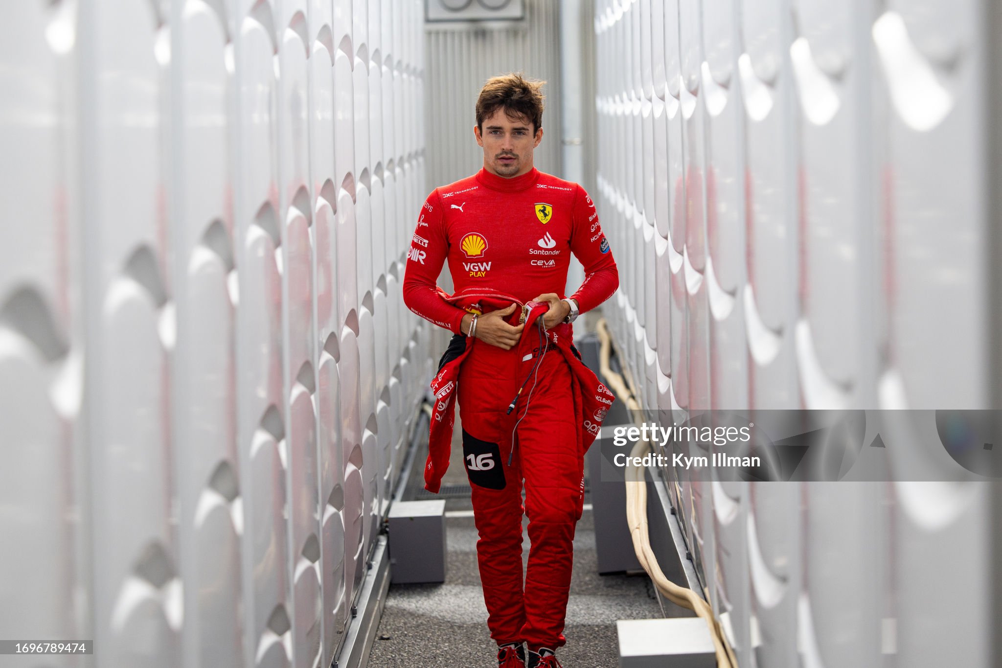 Charles Leclerc walks to the garage ahead of qualifying of the F1 Grand Prix of Japan at Suzuka Circuit on 23 September 2023 in Suzuka, Japan. 