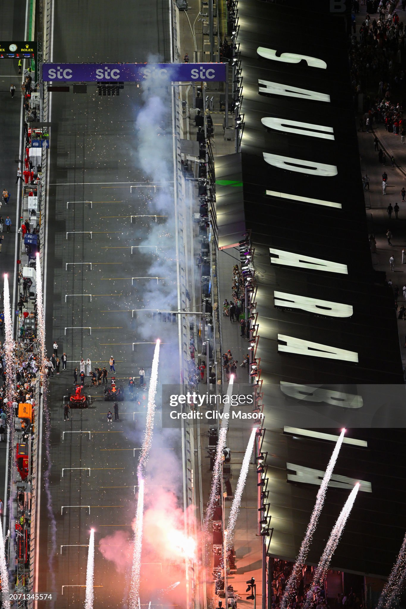 Fireworks go off as race winner Max Verstappen of the Netherlands driving the Red Bull Racing RB20, second placed Sergio Perez of Mexico and Red Bull Racing and third placed Charles Leclerc of Monaco and Ferrari stop in parc ferme after the F1 Grand Prix of Saudi Arabia at Jeddah Corniche Circuit on March 09, 2024. 