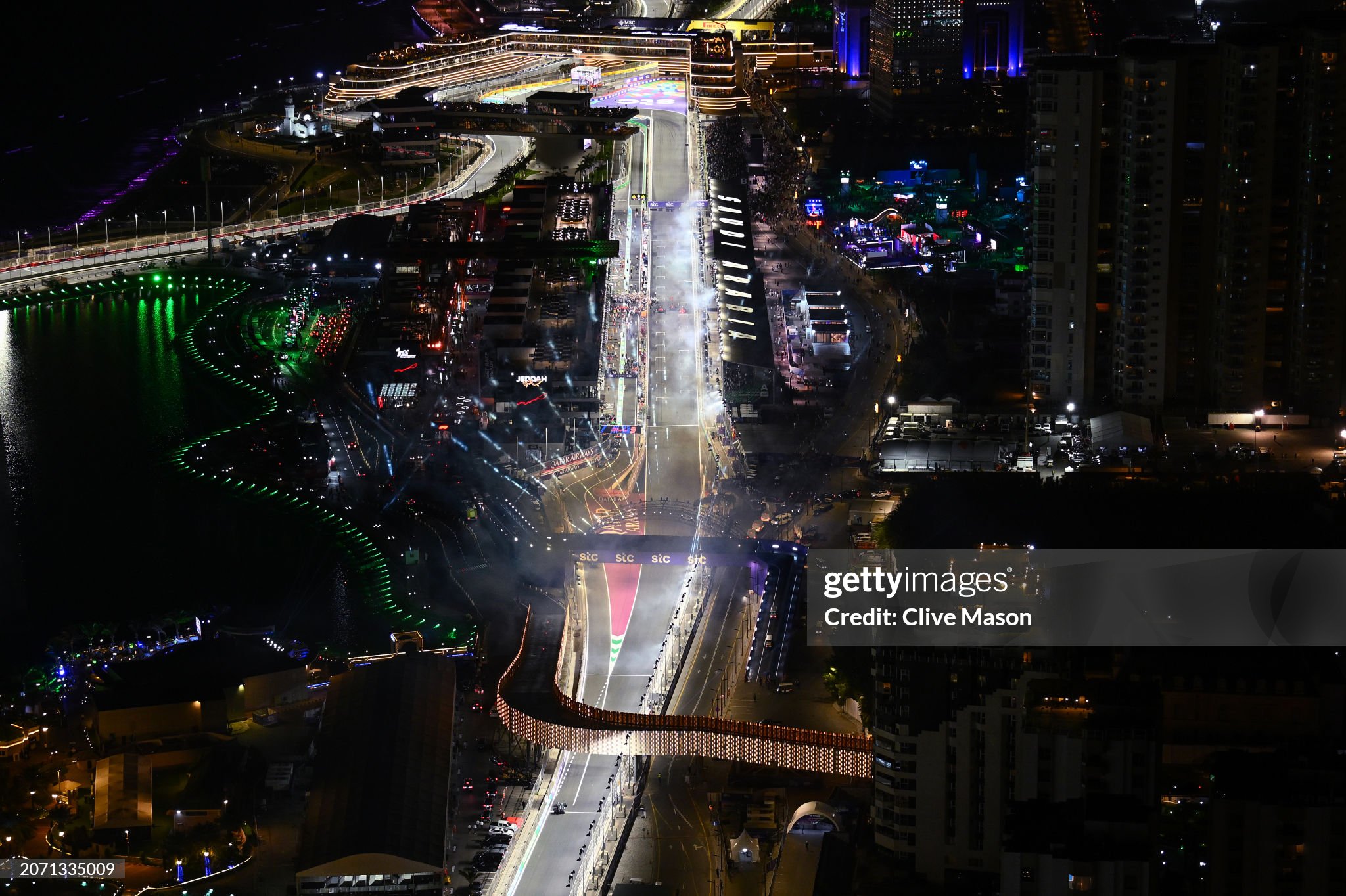 Fireworks go off as race winner Max Verstappen of the Netherlands driving the Red Bull Racing RB20, second placed Sergio Perez of Mexico and Red Bull Racing and third placed Charles Leclerc of Monaco and Ferrari stop in parc ferme after the F1 Grand Prix of Saudi Arabia at Jeddah Corniche Circuit on March 09, 2024. 