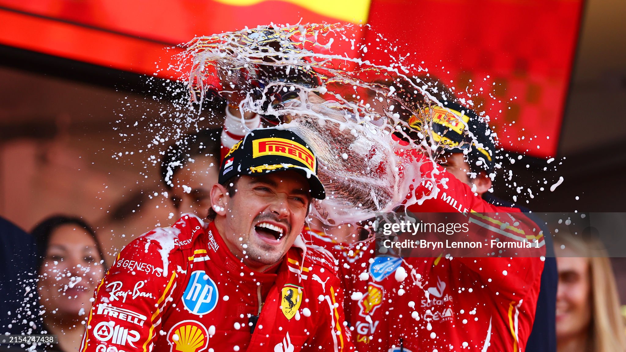 Race winner Charles Leclerc of Monaco and Ferrari and third placed Carlos Sainz of Spain and Ferrari celebrate on the podium after the F1 Grand Prix of Monaco at Circuit de Monaco on May 26, 2024. 