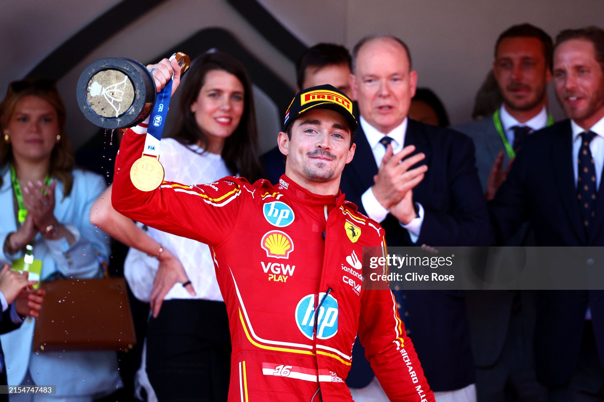 Race winner Charles Leclerc of Monaco and Ferrari celebrates on the podium after the F1 Grand Prix of Monaco at Circuit de Monaco on 26 May 2024 in Monte-Carlo, Monaco. 