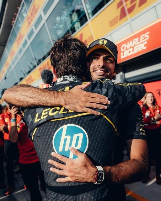 Carlos Sainz hugs Charles Leclerc after the 2024 Monza Grand Prix.