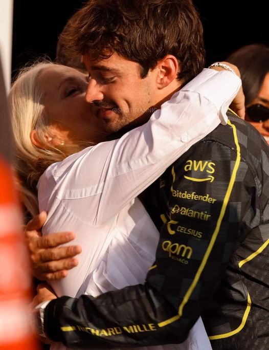 Charles Leclerc's mother hugs her victorious son at the 2024 Monza Grand Prix.