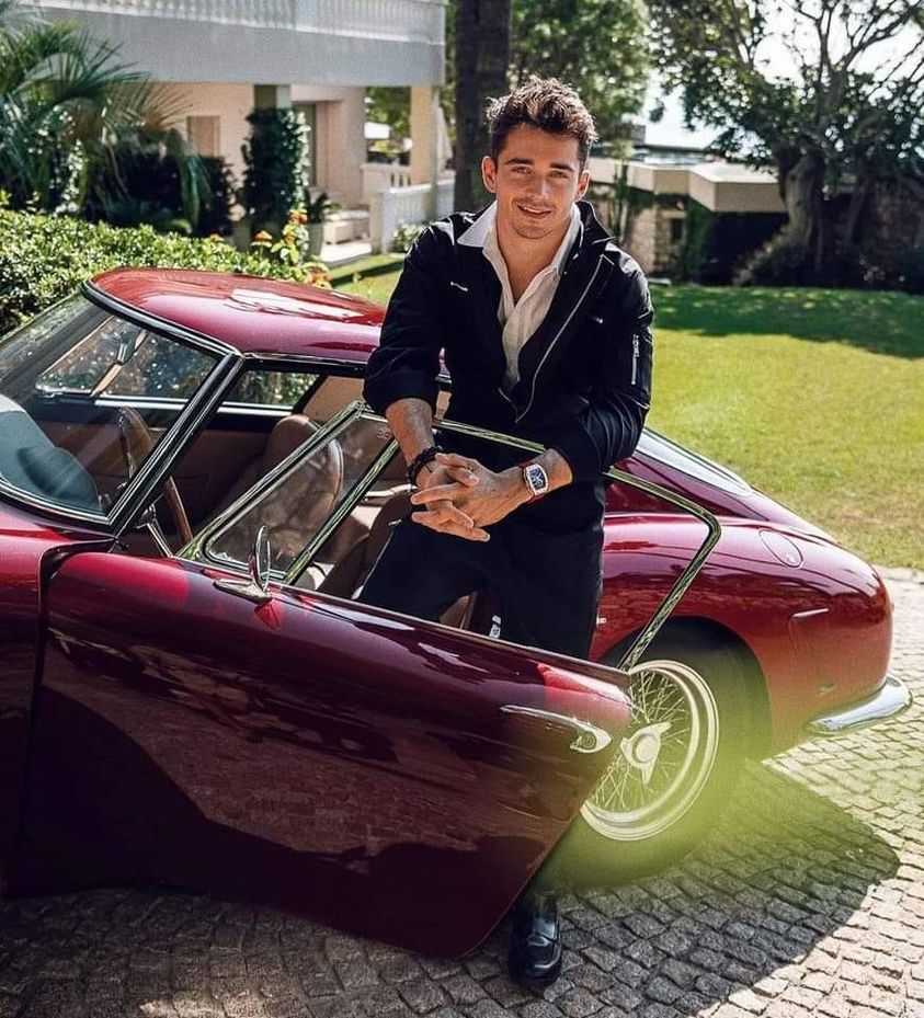 Charles Leclerc and a vintage car.