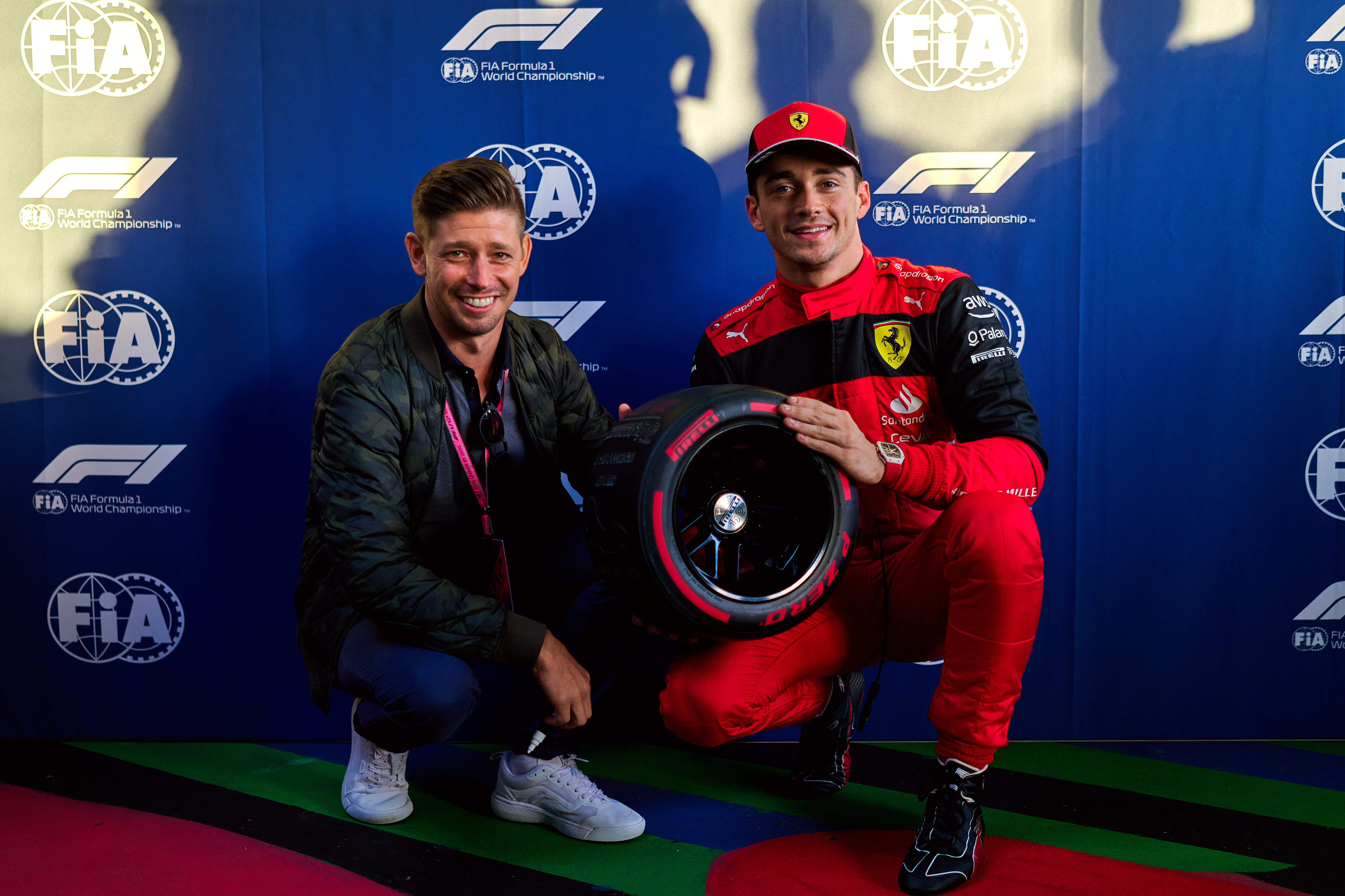 Charles Leclerc with Casey Stoner during qualifying of the 2022 Melbourne Grand Prix. 