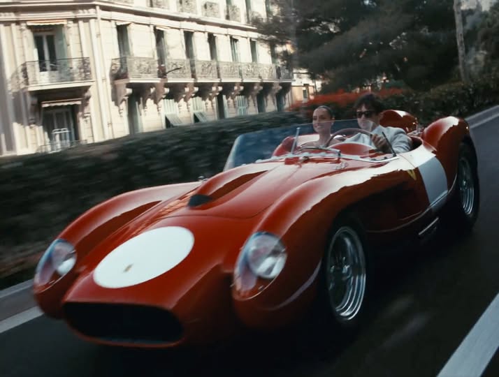 Charles and Alexandra riding together in a striking vintage red Ferrari 250 Testa Rossa.