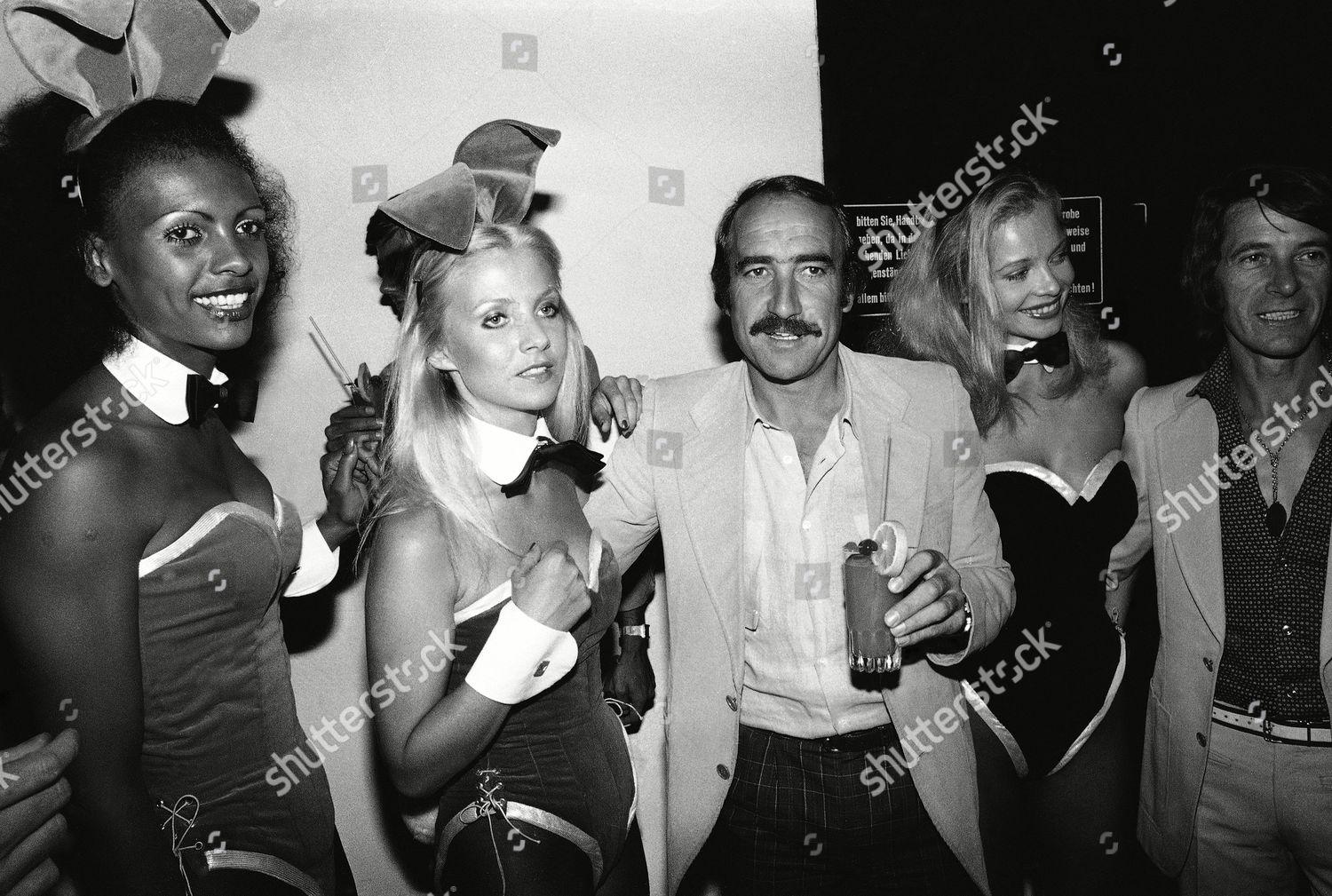 Clay Regazzoni with Arturio Merzario and three bunny girls.