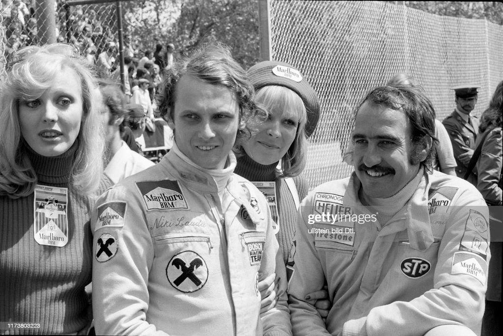 Niki Lauda and Clay Regazzoni, BRM, with ladies at the 1973 Spanish Grand Prix. 