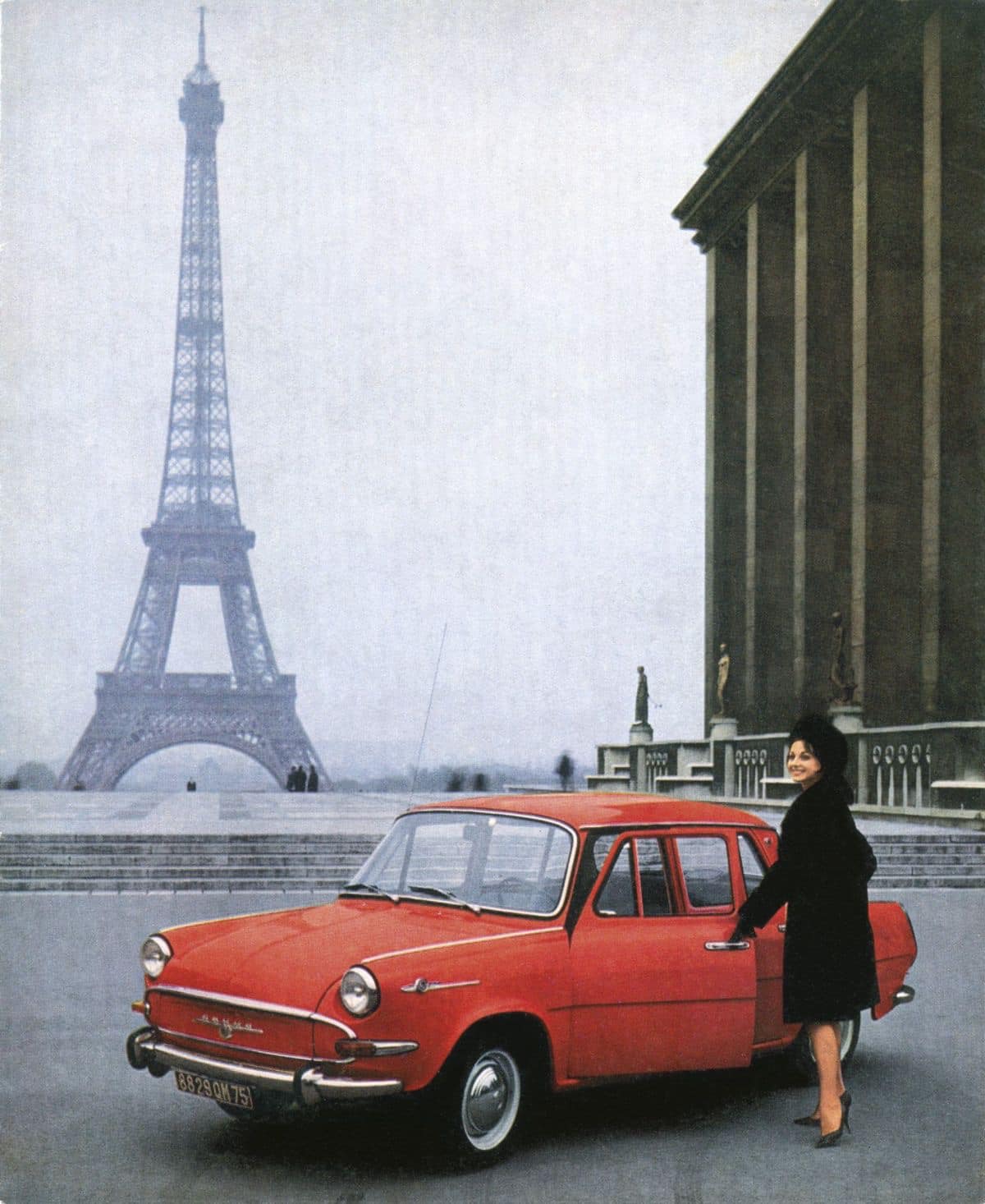 A lady and a red car in Paris.