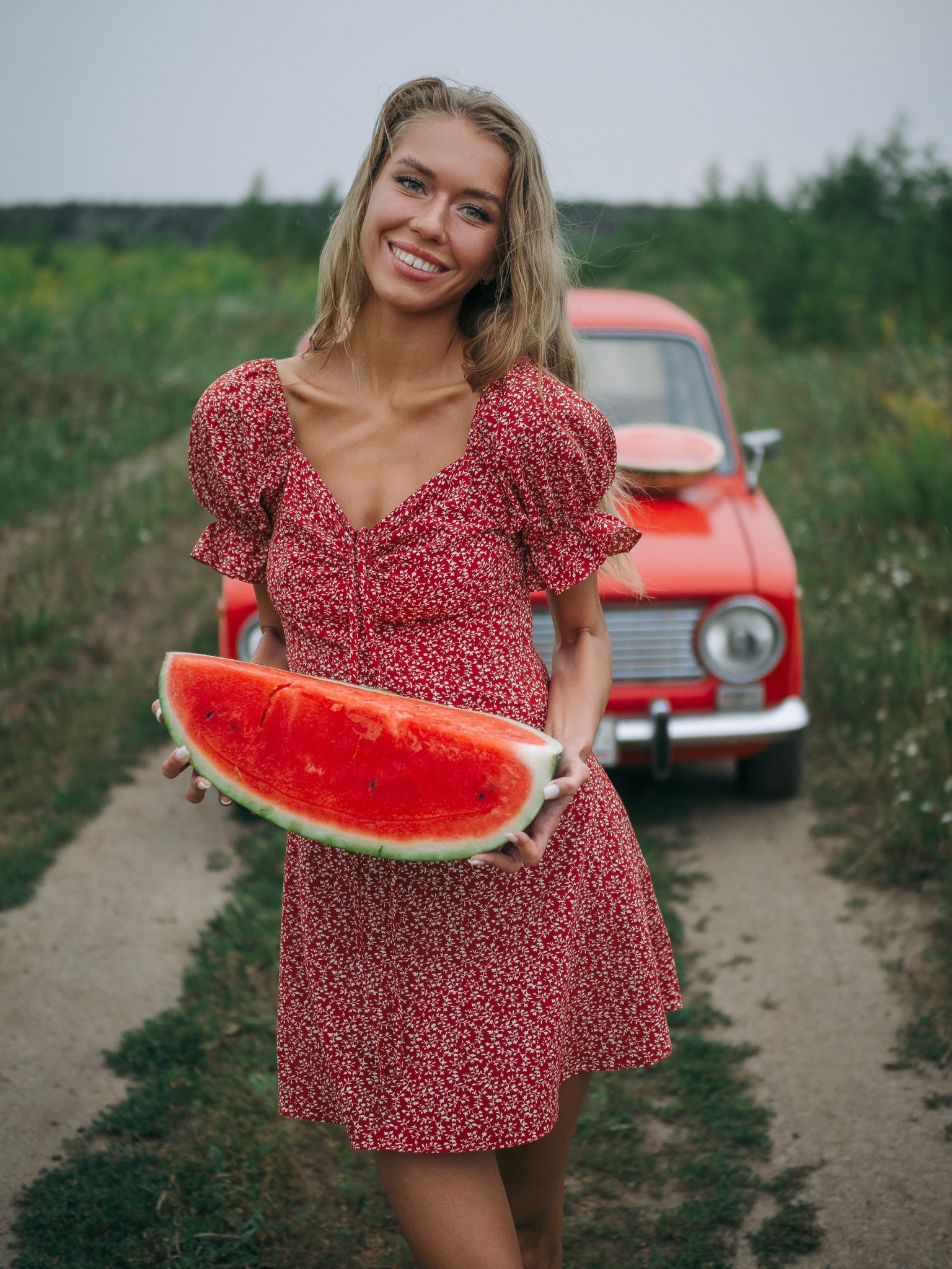 A blonde girl and a red Zhiguli.